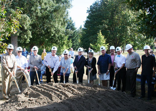 breaking ground at construction site