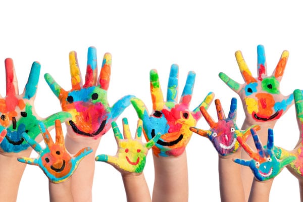 group of kids hands painted with smily faces