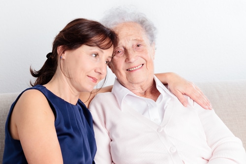 Senior woman with her home caregiver