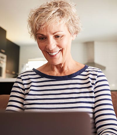 senior woman working on her laptop