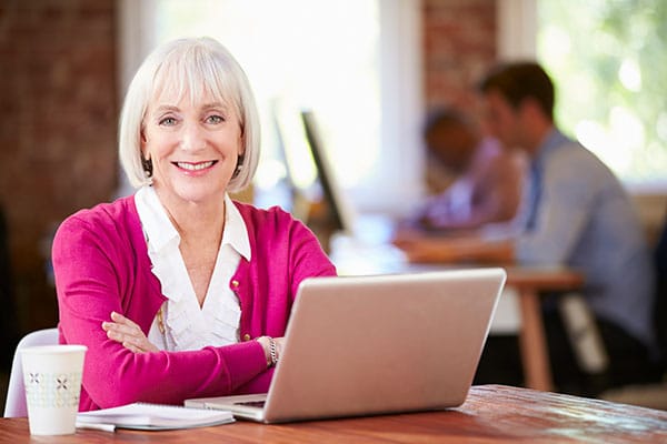 senior woman working on a laptop