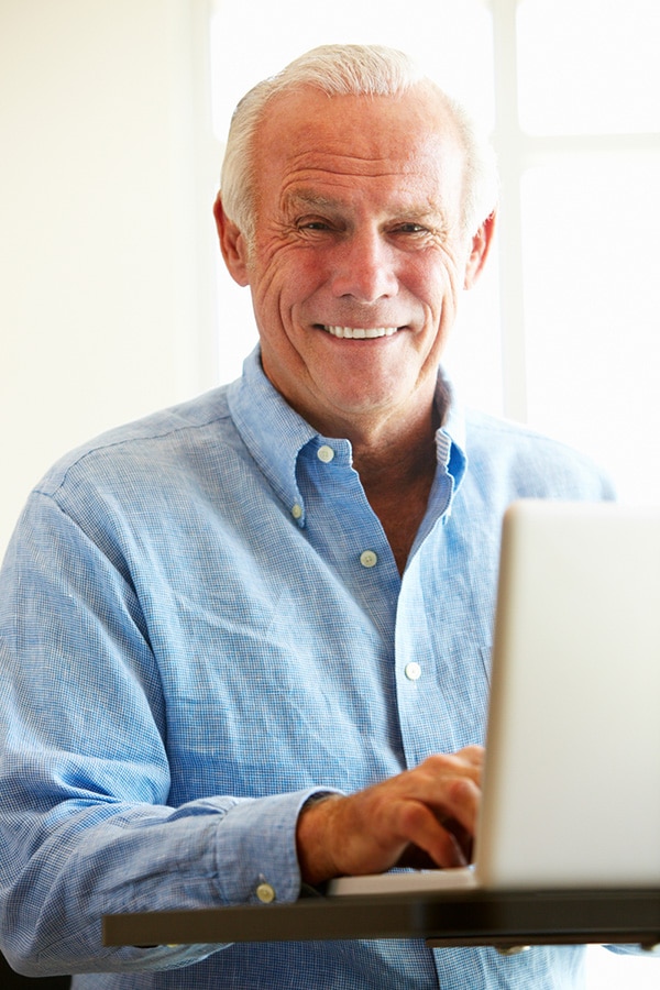 senior man working at his computer