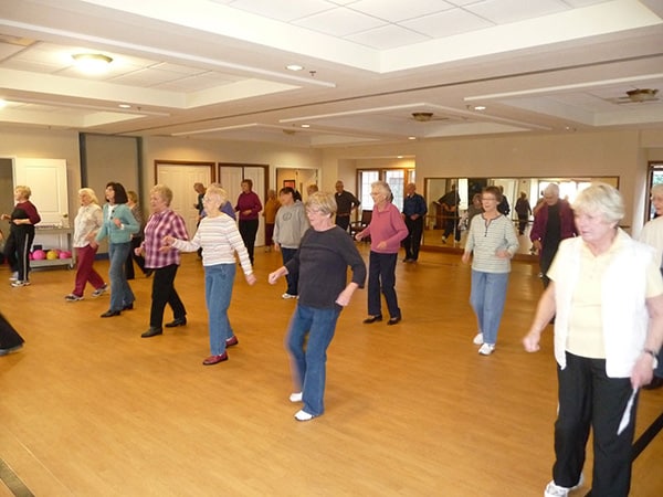 group of people line dancing