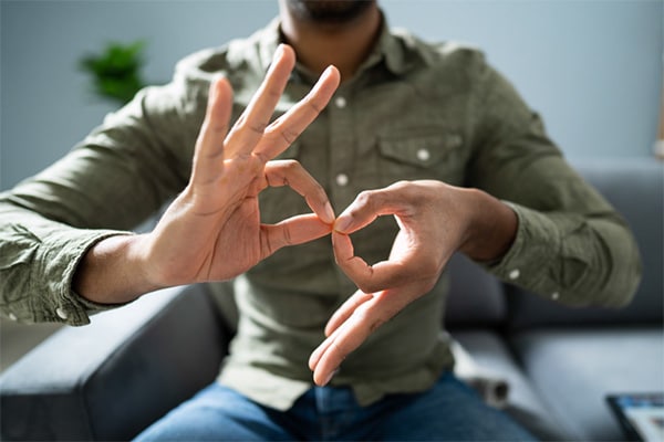 young man speaking using ASL