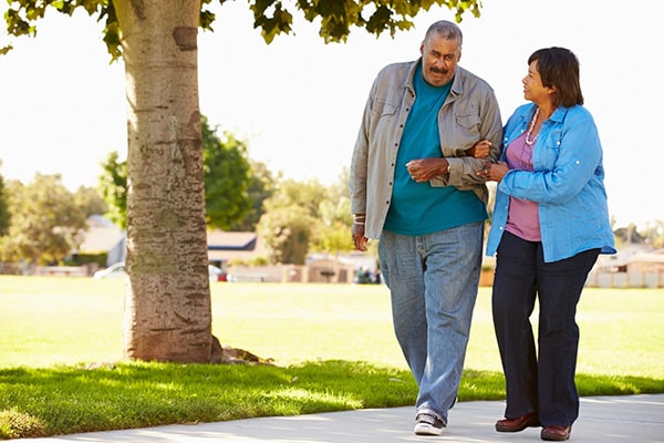 senior couple walking in the park