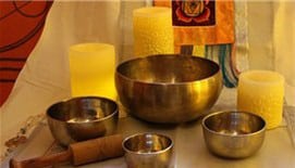 assorment of metal bowls and candles