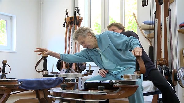 caregiver helping resident stretch