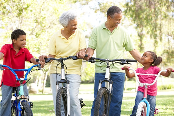 Seniors on bikes with grandkids