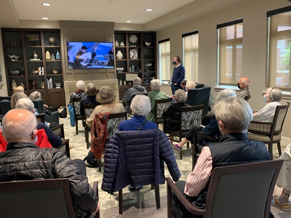 Residents watching a streaming musical performance