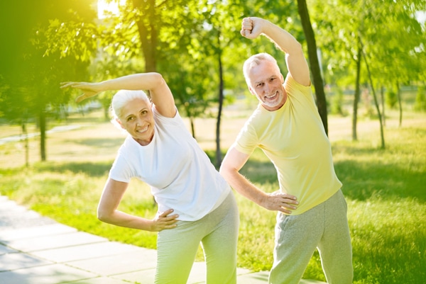 Senior couple practicing qigong.