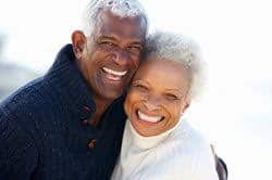 senior couple smiling for the camera