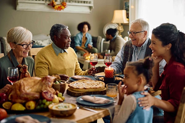 group of seniors enjoying Thanksgiving dinner together