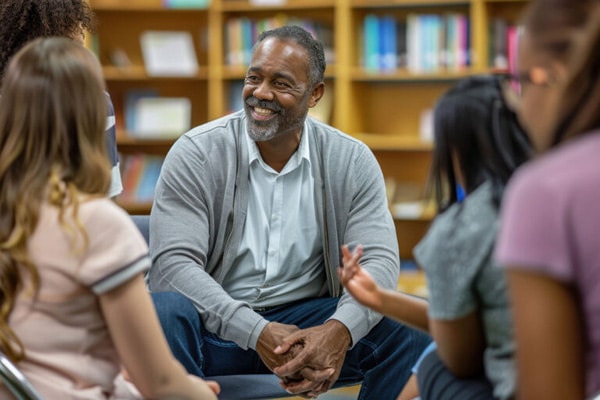 group of seniors talking in a library