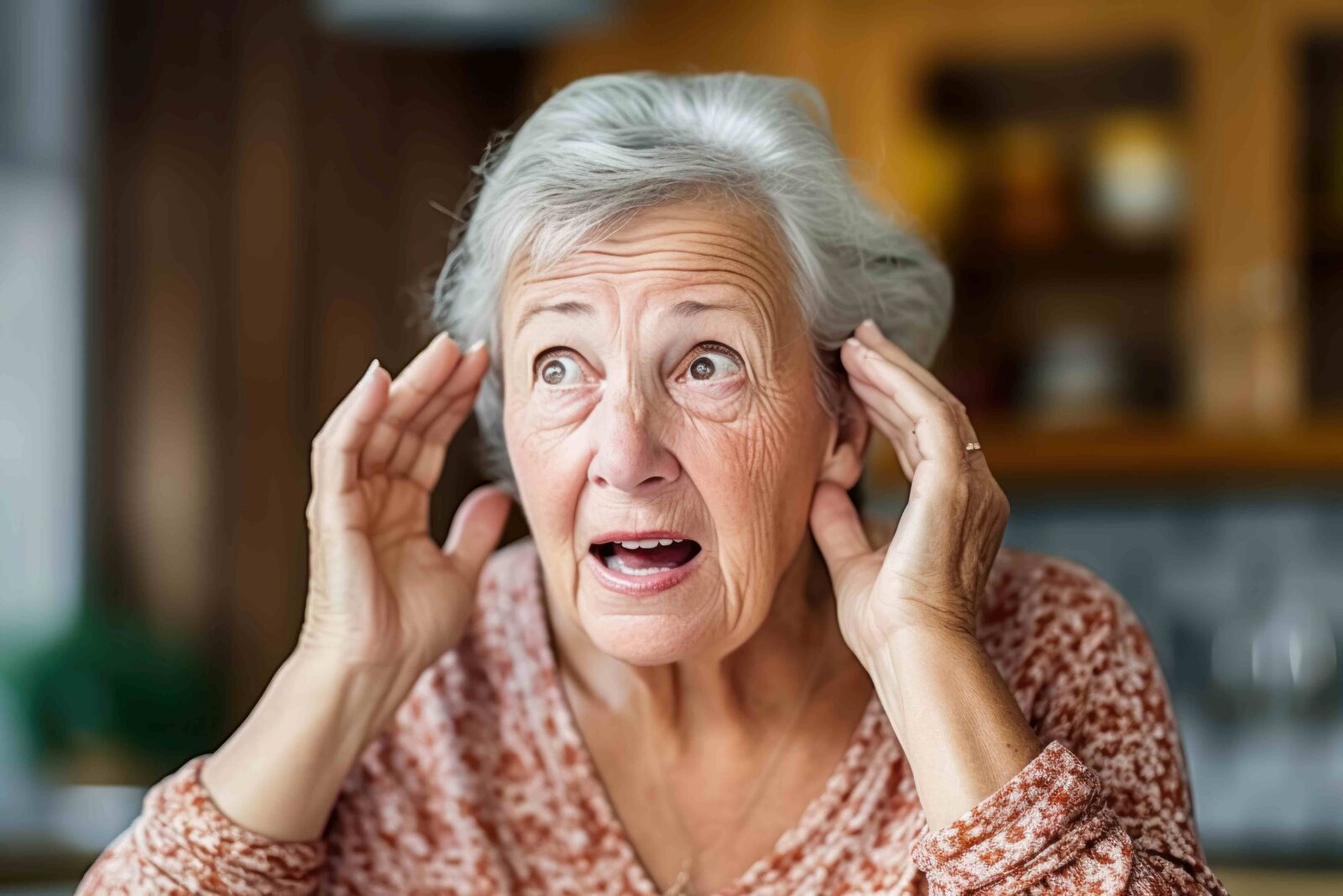 senior woman being alerted by loud noise with a concerned look on her face