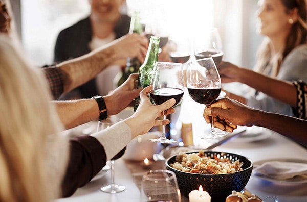 group of friends toasting their wine glasses